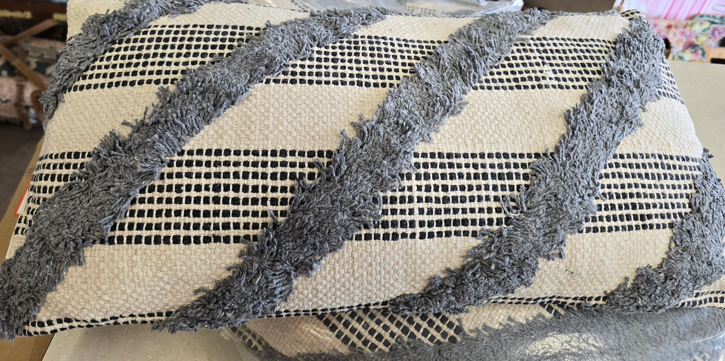 Long grey tuffed cushion